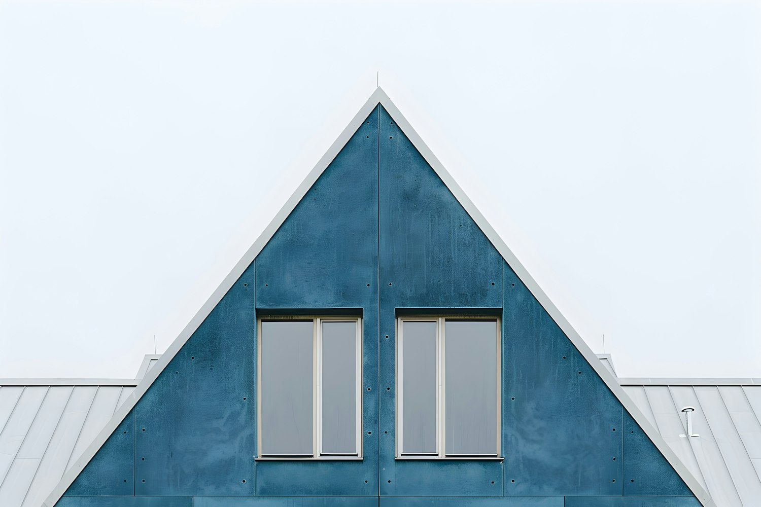 Steep gable dormer with a standing seam metal roof